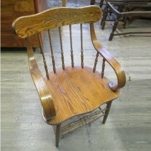 A wooden chair that has been restored at the centre.