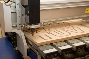 The centre's Computerised Numerical Cutter (CNC) machine cutting out block capital letters in MDF