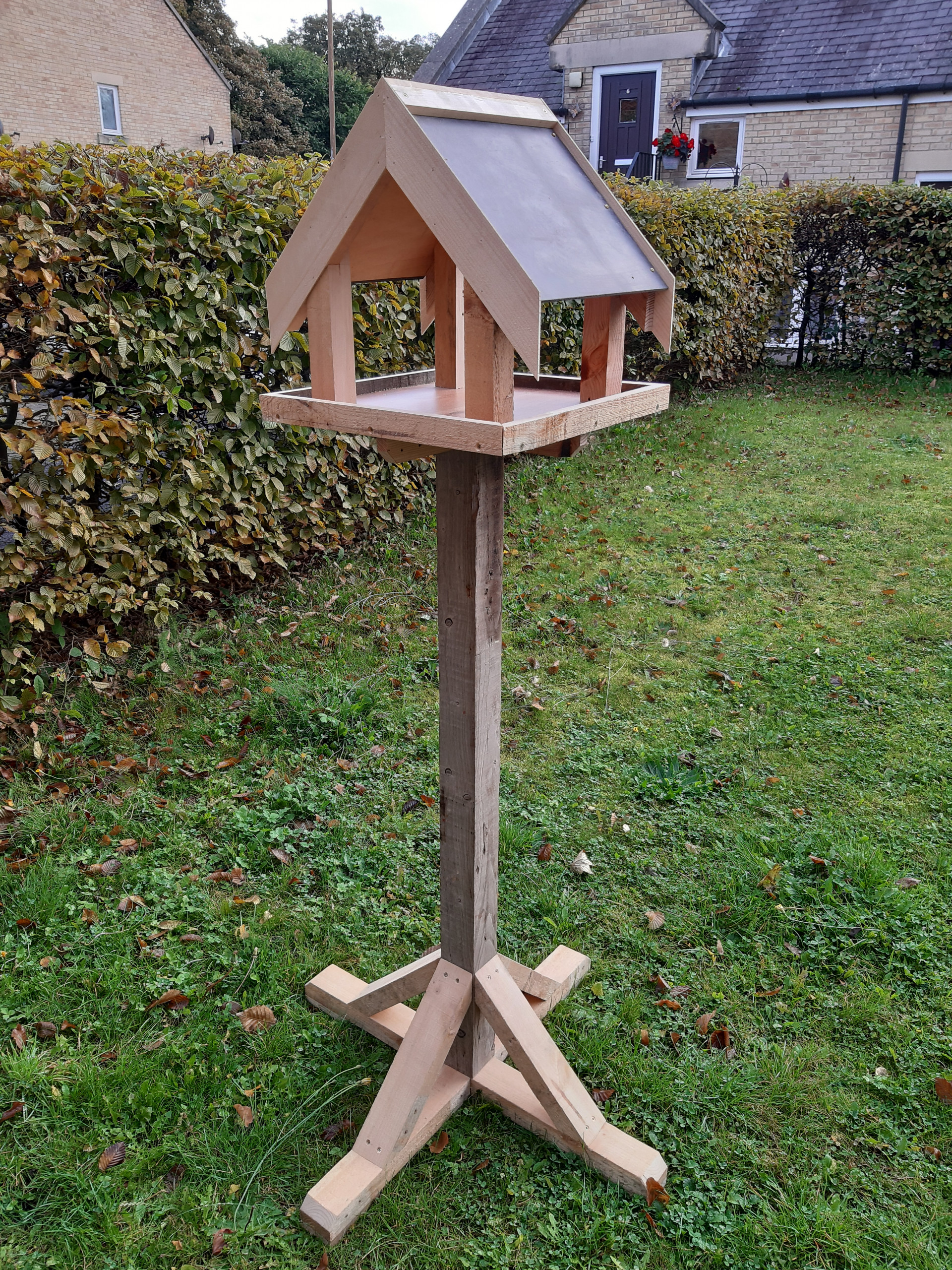 A birdhouse made from pallet wood