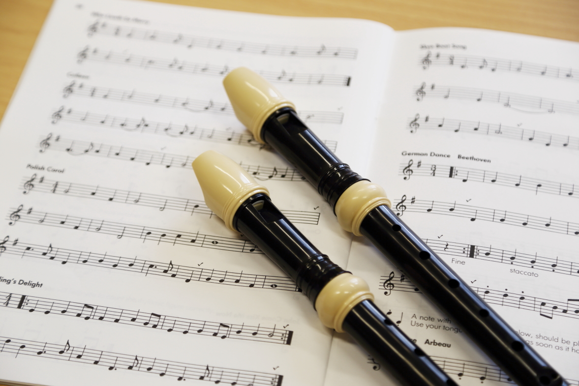 Two recorders over sheet music
